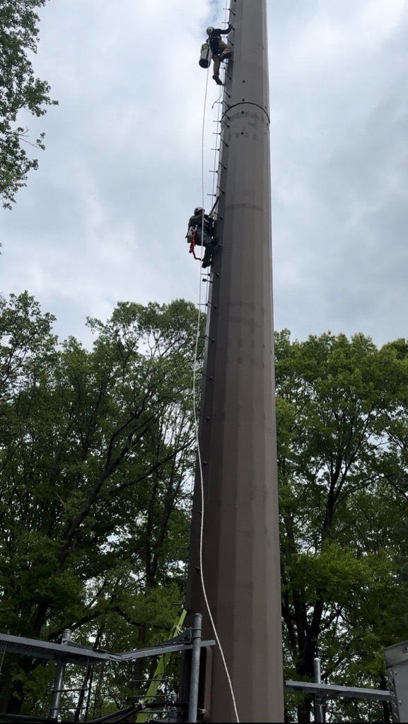 Antenna panels staged at a tower site